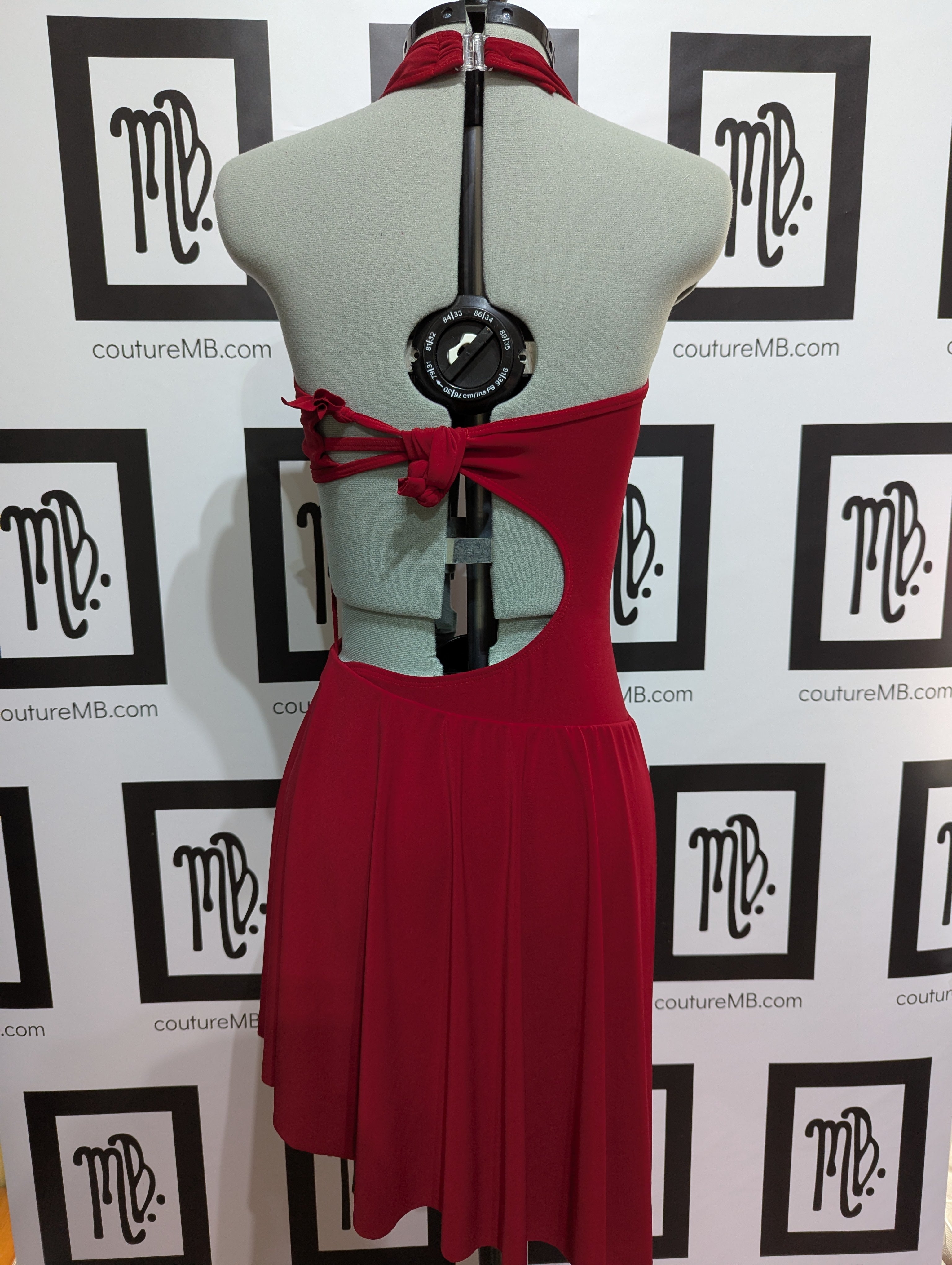 Abstract asymmetrical leotard with skirt and slit knots straps